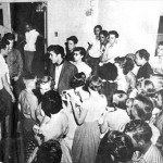 Buddy Holly (far right) watches Elvis