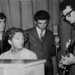 Buddy Holly shows Jerry Lee Lewis, Don Everly, and Jimmy Velvet how it’s done